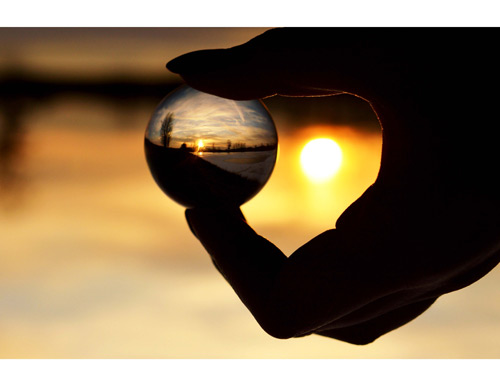 Reflected landscape image in glass ball