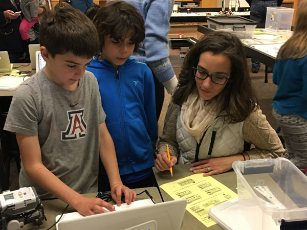 Two Robotics students with instructor