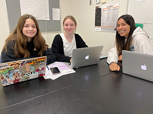 Three OG Students using laptop