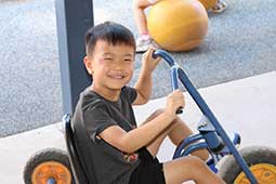 Kindergarten student on trike