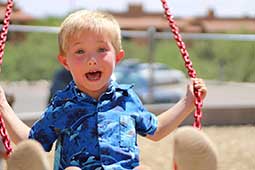 Kindergarten student on swing